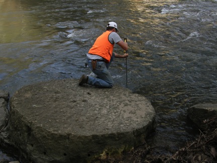 Dan Smith recording the measurements of the millstone