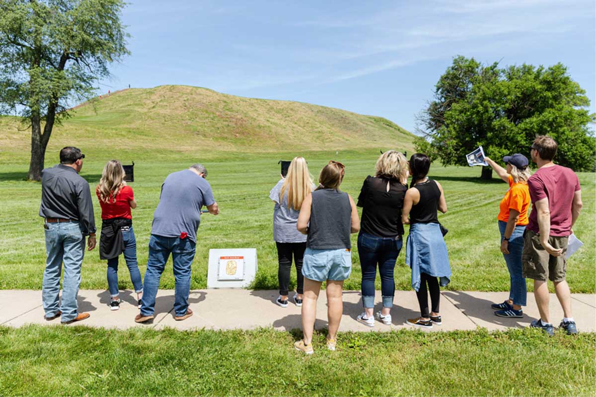 people looking at Cahokia mounds